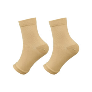 A pair of beige socks with a textured fabric and elasticated cuffs, suitable for everyday wear.