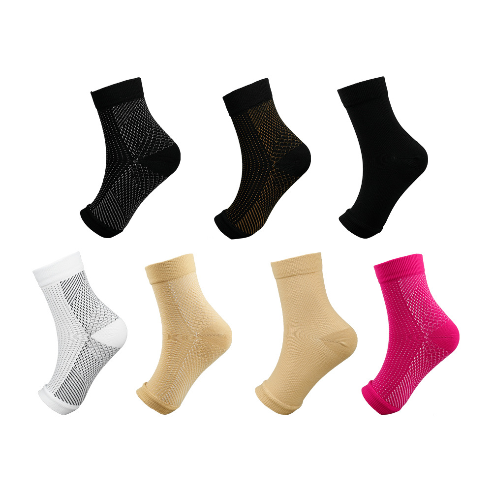 Six pairs of athletic socks in various colors with mesh design.