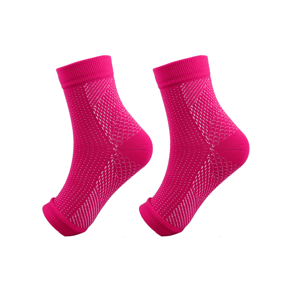 A pair of pink athletic socks with a mesh design for breathability and comfort.